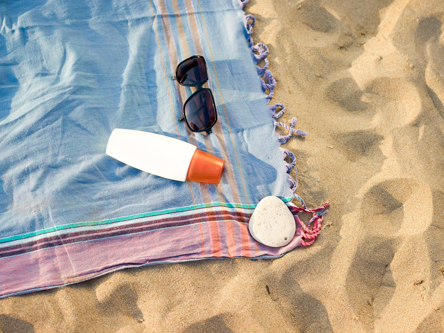 Beach towel and sun glasses